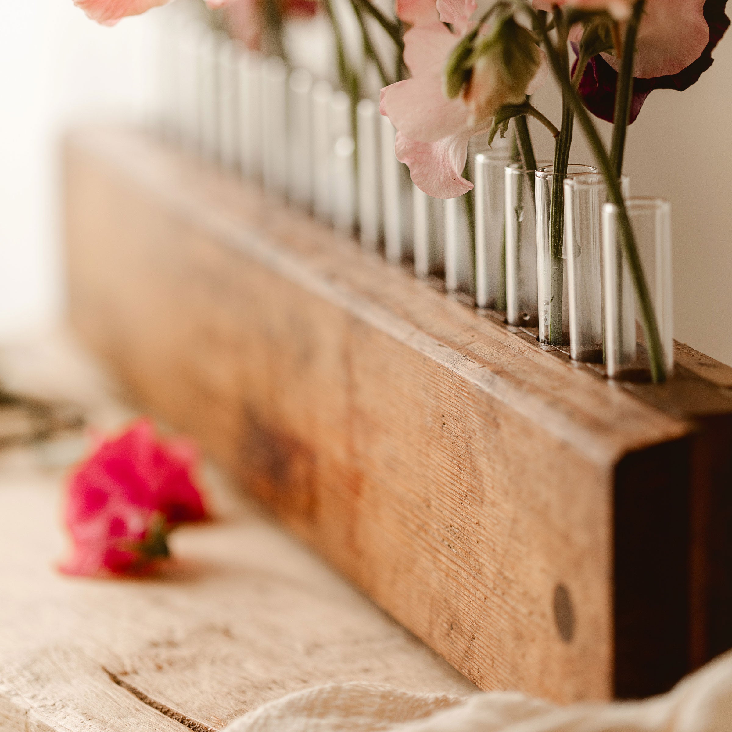 Close up of Vintage Cigar Press Vase with sweet pea flowers